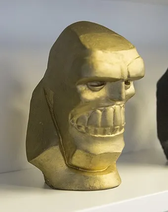 Premio dorado con forma de cabeza